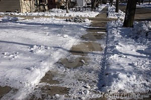 slippery-icy-sidewalk-city-12152438